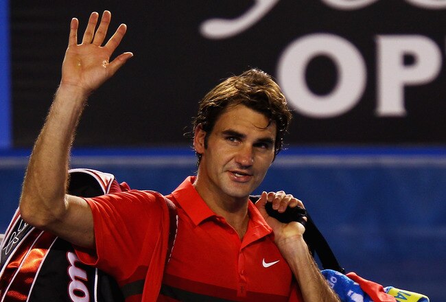 MELBOURNE, AUSTRALIA - JANUARY 26:  Roger Federer of Switzerland waves to the crowd after losing his semifinal match against Rafael Nadal of Spain during day eleven of the 2012 Australian Open at Melbourne Park on January 26, 2012 in Melbourne, Australia.  (Photo by Clive Brunskill/Getty Images)