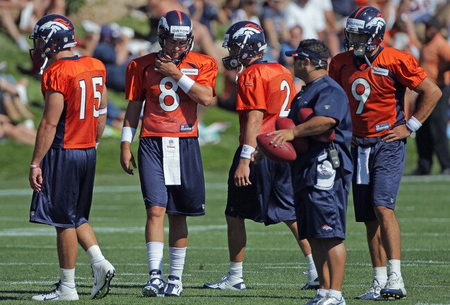 ENGLEWOOD, CO - JULY 28:  (L-R) Quarterbacks Tim Tebow #15, Kyle Orton #8, Adam Weber #2 and Brady Quinn #9 of the Denver Broncos take part in training camp at the Paul D. Bowlen Memorial Broncos Centre at Dove Valley on July 28, 2011 in Englewood, Colorado.  (Photo by Doug Pensinger/Getty Images)