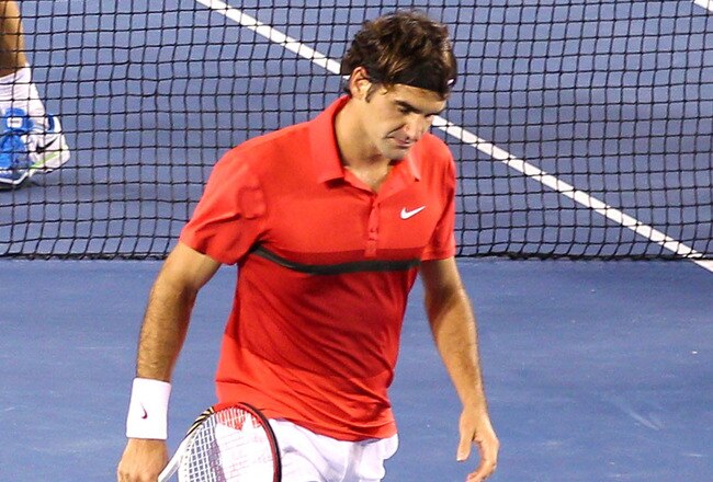 MELBOURNE, AUSTRALIA - JANUARY 26:  Roger Federer of Switzerland walks back to the baseline after losing a point to Rafael Nadal of Spain in their semifinal match during day eleven of the 2012 Australian Open at Melbourne Park on January 26, 2012 in Melbourne, Australia.  (Photo by Scott Barbour/Getty Images)
