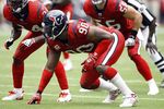 HOUSTON - SEPTEMBER 27:  Defensive end Mario Williams #90, Antonio Smith #94 and linebacker Brian Cushing #56 of the Houston Texans line up defensively during the game against the Jacksonville Jaguars at Reliant Stadium on September 27, 2009 in Houston, Texas.  (Photo by Bob Levey/Getty Images)
