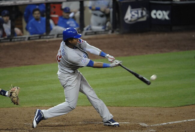 SAN DIEGO, CA - SEPTEMBER 28:  Starlin Castro #13 of the Chicago Cubs hits a double during the eighth inning of a baseball game against the San Diego Padres at Petco Park on September 28, 2011 in San Diego, California.  (Photo by Denis Poroy/Getty Images)