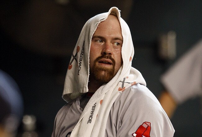 HOUSTON - JULY 03:  Kevin Youkilis #20 of the Boston Red Sox looks on from the dugout during a baseball game against the Houston Astros at Minute Maid Park on July 3, 2011 in Houston, Texas.  (Photo by Bob Levey/Getty Images)