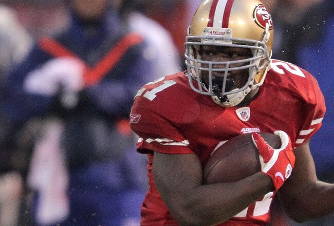 SAN FRANCISCO, CA - JANUARY 22:  Frank Gore #21 of the San Francisco 49ers runs the ball against Antrel Rolle #26 of the New York Giants during the NFC Championship Game at Candlestick Park on January 22, 2012 in San Francisco, California.  (Photo by Doug Pensinger/Getty Images)
