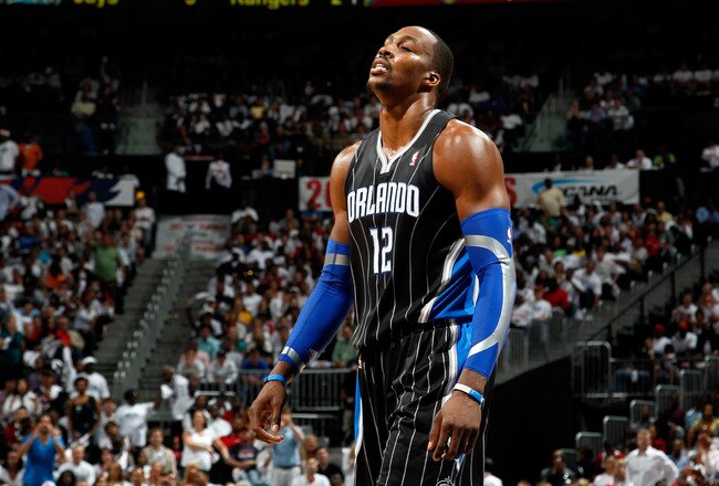 ATLANTA, GA - APRIL 28:  Dwight Howard #12 of the Orlando Magic walks to the bench after a turnover to the Atlanta Hawks during Game Six of the Eastern Conference Quarterfinals in the 2011 NBA Playoffs at Philips Arena on April 28, 2011 in Atlanta, Georgia.  NOTE TO USER: User expressly acknowledges and agrees that, by downloading and or using this photograph, User is consenting to the terms and conditions of the Getty Images License Agreement.  (Photo by Kevin C. Cox/Getty Images)