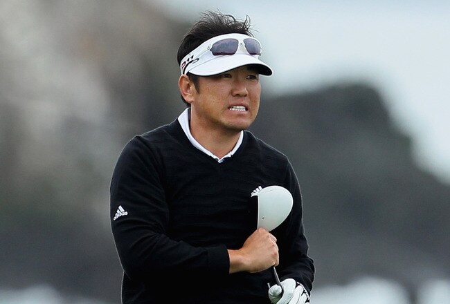PEBBLE BEACH, CA - FEBRUARY 10:  Charlie Wi of South Korea reacts to his tee shot on the 18th hole during the second round of the AT&T Pebble Beach National Pro-Am at Pebble Beach Golf Links on February 10, 2012 in Pebble Beach, California.  (Photo by Jeff Gross/Getty Images)
