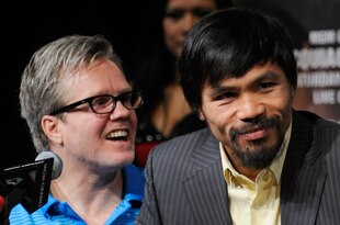 LAS VEGAS, NV - NOVEMBER 09:  Trainer Freddie Roach (L) and boxer Manny Pacquiao appear during the final news conference for Pacquiao's bout with Juan Manuel Marquez at the MGM Grand Hotel/Casino November 9, 2011 in Las Vegas, Nevada. Pacquiao will defend his WBO welterweight title against Marquez when the two meet in the ring for the third time on November 12 in Las Vegas.  (Photo by Ethan Miller/Getty Images)