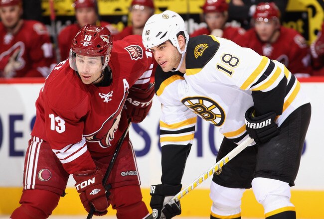 GLENDALE, AZ - DECEMBER 28:  Nathan Horton #18 (R) of the Boston Bruins stands at a face off with Ray Whitney #13 of the Phoenix Coyotes during the NHL game at Jobing.com Arena on December 28, 2011 in Glendale, Arizona. The Bruins defeated the Coyotes 2-1 in overtime.  (Photo by Christian Petersen/Getty Images)