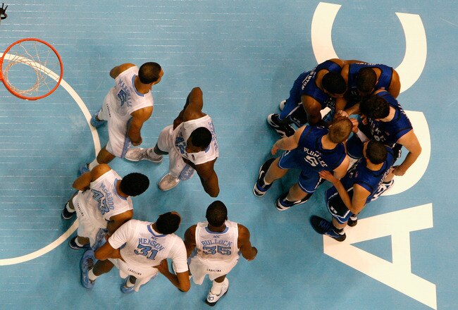 CHAPEL HILL, NC - FEBRUARY 08:  The North Carolina Tar Heels and the Duke Blue Devils huddle up before a free throw during their game at the Dean Smith Center on February 8, 2012 in Chapel Hill, North Carolina.  (Photo by Streeter Lecka/Getty Images)