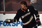 ANAHEIM, CA - JANUARY 10: Teemu Selanne #8 of the Anaheim Ducks throws a puck to fans during  warmups prior to the game against the Dallas Stars at the Honda Center on January 10, 2012 in Anaheim, California. The Ducks defeated the Stars 5-2.  (Photo by Bruce Bennett/Getty Images)