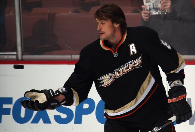 ANAHEIM, CA - JANUARY 10: Teemu Selanne #8 of the Anaheim Ducks throws a puck to fans during  warmups prior to the game against the Dallas Stars at the Honda Center on January 10, 2012 in Anaheim, California. The Ducks defeated the Stars 5-2.  (Photo by Bruce Bennett/Getty Images)