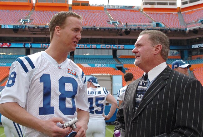 Peyton Manning of the Indianapolis Colts, left, talks with team owner Jim Irsay during Media Day prior to Super Bowl XLI at Dolphins Stadium in Miami, Florida on January 30, 2007. (Photo by A. Messerschmidt/Getty Images)