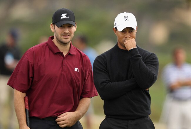 PEBBLE BEACH, CA - FEBRUARY 10: (L-R) Tony Romo, NFL football quarterback for the Dallas Cowboys, talks with Tiger Woods on the ninth green after putting during the second round of the AT&T Pebble Beach National Pro-Am at the Monterey Peninsula Country Club (Shore Course) on February 10, 2012 in Pebble Beach, California.  (Photo by Ezra Shaw/Getty Images)