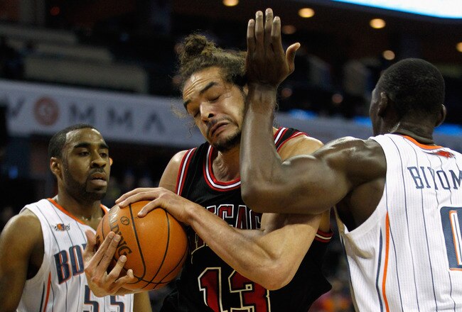CHARLOTTE, NC - FEBRUARY 10:  Reggie Williams #55 of the Charlotte Bobcats watches teammates Bismack Biyombo #0 hit Joakim Noah #13 of the Chicago Bulls in the face during their game at Time Warner Cable Arena on February 10, 2012 in Charlotte, North Carolina. NOTE TO USER: User expressly acknowledges and agrees that, by downloading and or using this photograph, User is consenting to the terms and conditions of the Getty Images License Agreement.  (Photo by Streeter Lecka/Getty Images)