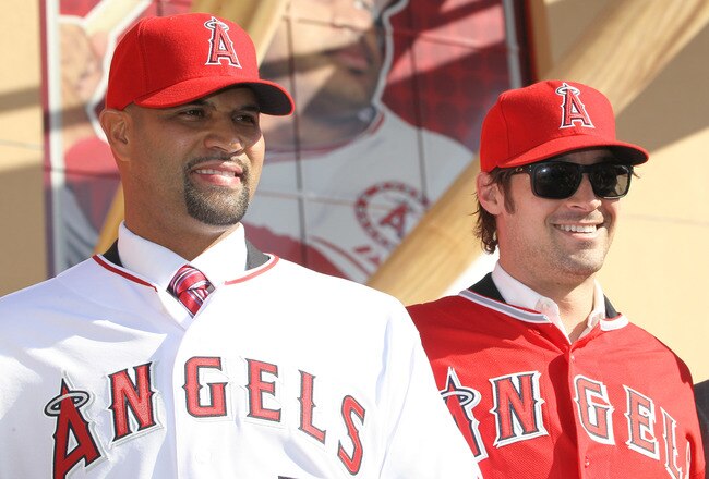 ANAHEIM, CA - DECEMBER 10:  Albert Pujols #5 (L) and C.J. Wilson #33 stand together at a public press conference introducing them as newly signed Los Angeles Angels of Anaheim  players at Angel Stadium on December 10, 2011 in Anaheim, California.  (Photo by Stephen Dunn/Getty Images)