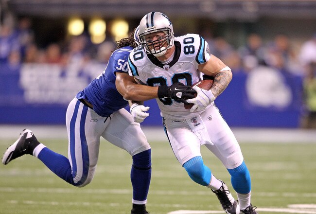 INDIANAPOLIS, IN - NOVEMBER 27: Jeremy Shockey#80 of the Carolina Panthers runs with the ball while defended by Philip Wheeler #50 of the Indianapolis Colts during the game at Lucas Oil Stadium on November 27, 2011 in Indianapolis, Indiana.  (Photo by Andy Lyons/Getty Images)