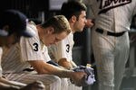 MINNEAPOLIS, MN - AUGUST 23: Justin Morneau #33 and Joe Mauer #7 of the Minnesota Twins sit in the dugout during the eighth inning against the Baltimore Orioles on August 23, 2011 at Target Field in Minneapolis, Minnesota. The Orioles defeated the Twins 8-1. (Photo by Hannah Foslien/Getty Images)