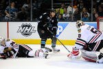 SAN JOSE, CA - FEBRUARY 10:  Joe Thornton #19 of the San Jose Sharks attacks the net against goaltender Corey Crawford #50 of the Chicago Blackhawks  at HP Pavilion at San Jose on February 10, 2012 in San Jose, California.  (Photo by Thearon W. Henderson/Getty Images)