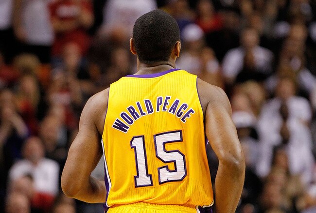 MIAMI, FL - JANUARY 19: Metta World Peace #15 of the Los Angeles Lakers looks on during a game against the Miami Heat at American Airlines Arena on January 19, 2012 in Miami, Florida. NOTE TO USER: User expressly acknowledges and agrees that, by downloading and/or using this Photograph, User is consenting to the terms and conditions of the Getty Images License Agreement.  (Photo by Mike Ehrmann/Getty Images)