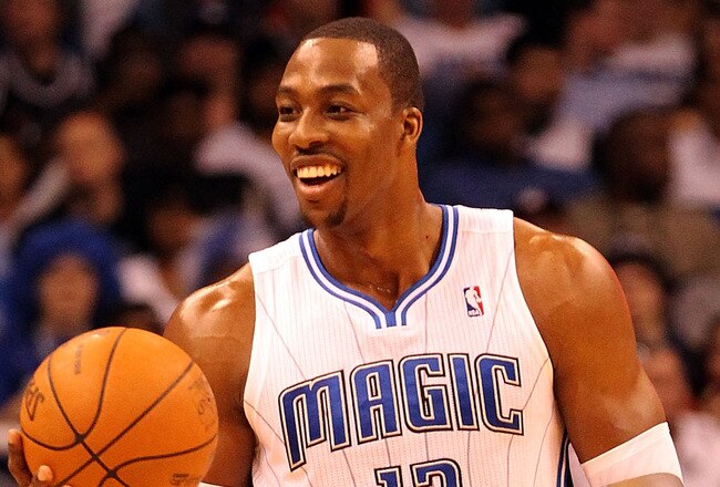 ORLANDO, FL - FEBRUARY 06:  Dwight Howard #12 of the Orlando Magic smiles during the game against the Los Angeles Clippers at Amway Center on February 6, 2012 in Orlando, Florida.   NOTE TO USER: User expressly acknowledges and agrees that, by downloading and or using this Photograph, user is consenting to the terms and conditions of the Getty Images License Agreement.  (Photo by Sam Greenwood/Getty Images)