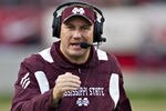 LITTLE ROCK, AR - NOVEMBER 19:   Head Coach Dan Mullen of the Mississippi State Bulldogs talks into his headset during a game against the Arkansas Razorbacks at War Memorial Stadium on November 19, 2011 in Little Rock, Arkansas. The Razorbacks defeated the Bulldogs 44-17.  (Photo by Wesley Hitt/Getty Images)