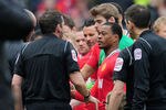 MANCHESTER, ENGLAND - FEBRUARY 11:  Patrice Evra of Manchester United talks to referee Phil Dowd after Luis Suarez of Liverpool failed to shake his hand during the Barclays Premier League match between Manchester United and Liverpool at Old Trafford on February 11, 2012 in Manchester, England.  (Photo by Shaun Botterill/Getty Images)