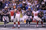 INDIANAPOLIS, IN - FEBRUARY 05:  Victor Cruz #80 of the New York Giants hauls in a two-yard touchdown against James Ihedigbo #44 of the New England Patriots in the first quarter during Super Bowl XLVI at Lucas Oil Stadium on February 5, 2012 in Indianapolis, Indiana.  (Photo by Elsa/Getty Images)