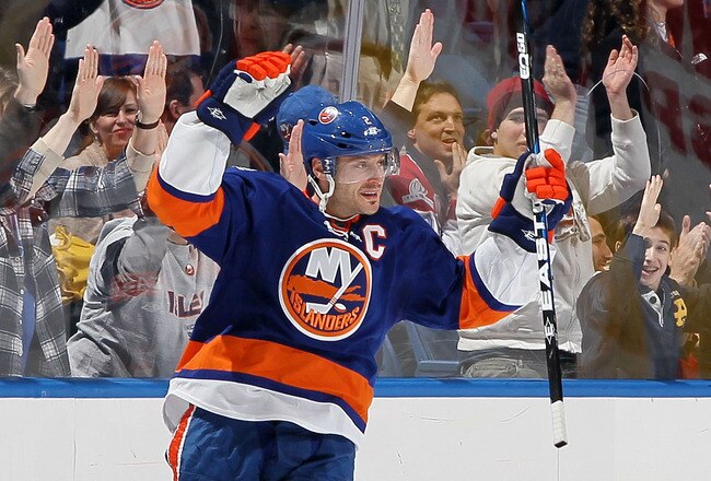 UNIONDALE, NY - FEBRUARY 09:  Mark Streit #2 of the New York Islanders celebrates his goal against the Montreal Canadiens on February 9, 2012 at Nassau Coliseum in Uniondale, New York.  (Photo by Jim McIsaac/Getty Images)