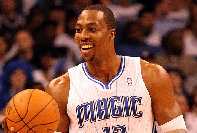 ORLANDO, FL - FEBRUARY 06:  Dwight Howard #12 of the Orlando Magic smiles during the game against the Los Angeles Clippers at Amway Center on February 6, 2012 in Orlando, Florida.   NOTE TO USER: User expressly acknowledges and agrees that, by downloading and or using this Photograph, user is consenting to the terms and conditions of the Getty Images License Agreement.  (Photo by Sam Greenwood/Getty Images)
