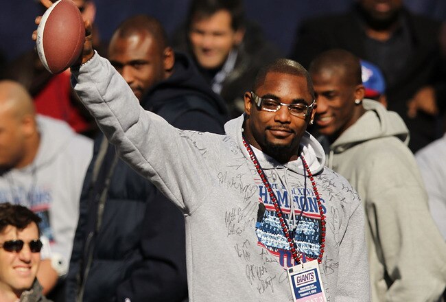 NEW YORK, NY - FEBRUARY 07:  Ahmad Bradshaw of the New York Giants walks onto the stage as the team is honored at City Hall Plaza following a ticker-tape parade in Manhattan for the second time in four years after winning the Super Bowl against the New England Patriots on February 7, 2012 in New York City. The Giants beat the Patriots 21-17 at Lucas Oil Stadium in Indianapolis on February 5. The New York parade started at Battery Place and continued through the financial district, an area known as the 'Canyon of Heroes,' to be followed by a rally at their home MetLife Stadium in East Rutherford, New Jersey.  (Photo by Spencer Platt/Getty Images)