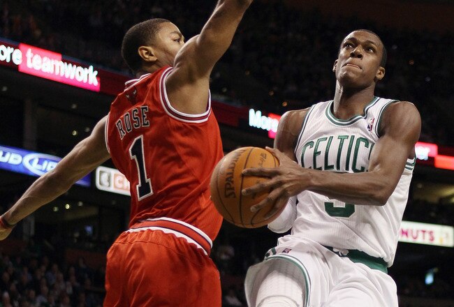 BOSTON, MA - NOVEMBER 05:  Rajon Rondo #9 of the Boston Celtics takes a shot as Derrick Rose #1 of the Chicago Bulls defends on November 5, 2010 at the TD Garden in Boston, Massachusetts.  NOTE TO USER: User expressly acknowledges and agrees that, by downloading and/or using this Photograph, User is consenting to the terms and conditions of the Getty Images License Agreement.  (Photo by Elsa/Getty Images)