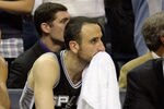 MEMPHIS, TN - APRIL 25: George Hill #3, Tim Duncan #21 and Manu Ginobili #20 of the San Antonio Spurs watch from the bench in the fourth quarter during the game against the Memphis Grizzlies in Game Four of the Western Conference Quarterfinals in the 2011 NBA Playoffs at FedExForum on April 25, 2011 in Memphis, Tennessee. The Grizzlies won 104-86. NOTE TO USER: User expressly acknowledges and agrees that, by downloading and/or using this Photograph, User is consenting to the terms and conditions of the Getty Images License Agreement.  (Photo by Andy Lyons/Getty Images)