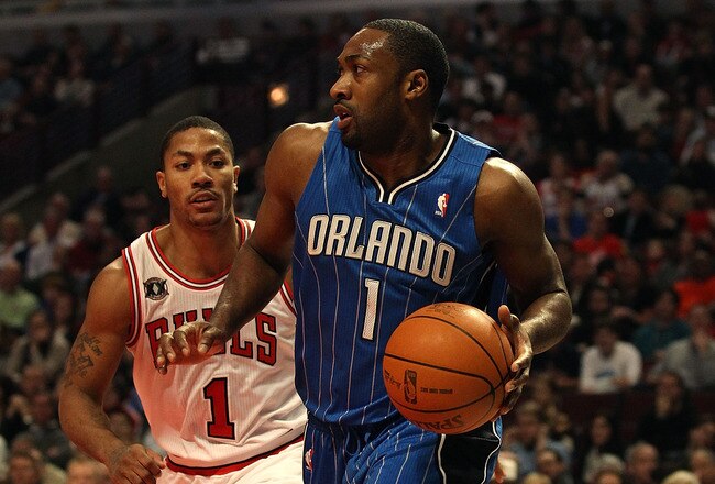 CHICAGO, IL - JANUARY 28: Gilbert Arenas #1 of the Orlando Magic moves past Derrick Rose #1 of the Chicago Bulls at the United Center on January 28, 2011 in Chicago, Illinois. The Bulls defeated the Magic 99-90. NOTE TO USER: User expressly acknowledges and agrees that, by downloading and/or using this photograph, User is consenting to the terms and conditions of the Getty Images License Agreement.  (Photo by Jonathan Daniel/Getty Images)