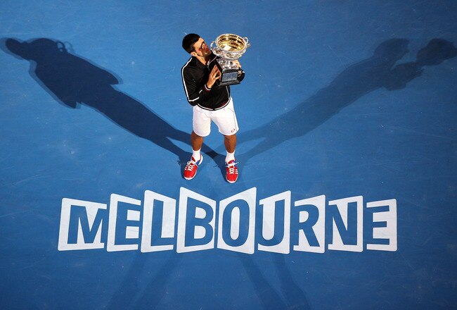 MELBOURNE, AUSTRALIA - JANUARY 29:  Novak Djokovic of Serbia poses with the Norman Brookes Challenge Cup after winning the men's final match against Rafael Nadal of Spain during day fourteen of the 2012 Australian Open at Melbourne Park on January 29, 2012 in Melbourne, Australia.  (Photo by Cameron Spencer/Getty Images)
