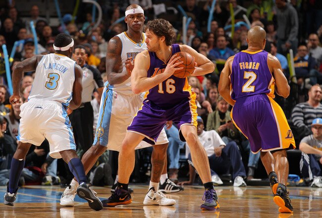 DENVER, CO - FEBRUARY 03:  Pau Gasol #16 of the Los Angeles Lakers controls the ball against Al Harrington #7 of the Denver Nuggets at the Pepsi Center on February 3, 2012 in Denver, Colorado. NOTE TO USER: User expressly acknowledges and agrees that, by downloading and or using this photograph, User is consenting to the terms and conditions of the Getty Images License Agreement.  (Photo by Doug Pensinger/Getty Images)