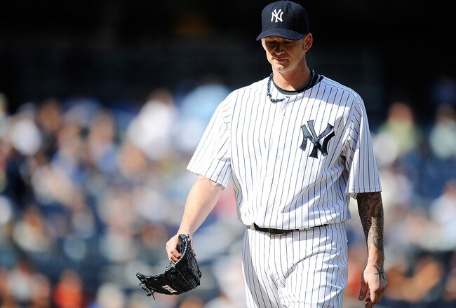 NEW YORK, NY - SEPTEMBER 19:  A.J. Burnett #34 of the New York Yankees walks off the field during the fifth inning against the Minnesota Twins at Yankee Stadium on September 19, 2011 in the Bronx borough of New York City.  (Photo by Patrick McDermott/Getty Images)