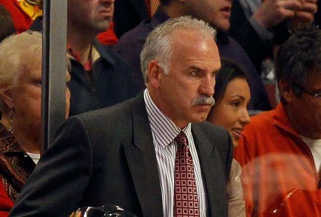 CHICAGO - MAY 21:  Head coach Joe Quenneville of the Chicago Blackhawks looks on from behind the bench while taking on the San Jose Sharks in Game Three of the Western Conference Finals during the 2010 NHL Stanley Cup Playoffs at the United Center on May 21, 2010 in Chicago, Illinois.  (Photo by Jonathan Daniel/Getty Images)