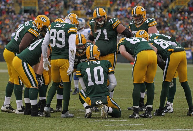 GREEN BAY, WI - JANUARY 01:  Matt Flynn #10 of the Green Bay Packers calls a play in the huddle against the Detroit Lions at Lambeau Field on January 1, 2012 in Green Bay, Wisconsin. The Packers defeated the Lions 45-41.  (Photo by Jonathan Daniel/Getty Images)