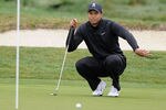 PEBBLE BEACH, CA - FEBRUARY 11: Tiger Woods lines up his putt on the 11th hole during the third round of the AT&T Pebble Beach National Pro-Am at Pebble Beach Golf Links on February 11, 2012 in Pebble Beach, California.  (Photo by Harry How/Getty Images)
