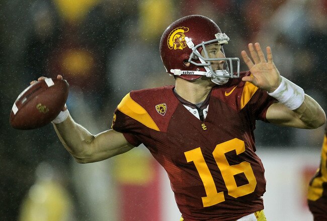 LOS ANGELES - NOVEMBER 27: Quarterback Mitch Mustain #16 of the USC Trojans throws a pass against the Notre Dame Fighting Irish at the Los Angeles Memorial Coliseum on November 27, 2010 in Los Angeles, California.  Notre Dame won 20-16.  (Photo by Stephen Dunn/Getty Images)