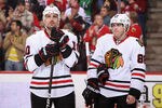 GLENDALE, AZ - FEBRUARY 11:  Patrick Sharp #10 and Patrick Kane #88 of the Chicago Blackhawks wait for a face off against the Phoenix Coyotes during the NHL game at Jobing.com Arena on February 11, 2012 in Glendale, Arizona. The Coyotes defeated the Blackhawks 3-0.  (Photo by Christian Petersen/Getty Images)