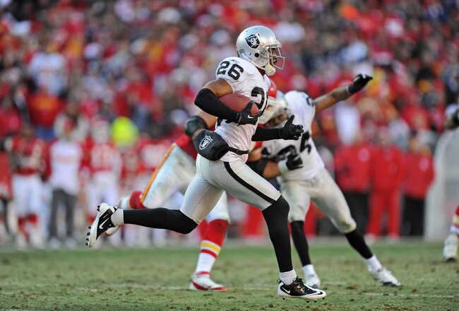KANSAS CITY, MO - DECEMBER 24:  Defensive back Stanford Routt #26 of the Oakland Raiders returns an interception against the Kansas City Chiefs during the second half on December 24, 2011 at Arrowhead Stadium in Kansas City, Missouri.  Oakland defeated Kansas City 16-13 in overtime.  (Photo by Peter Aiken/Getty Images)