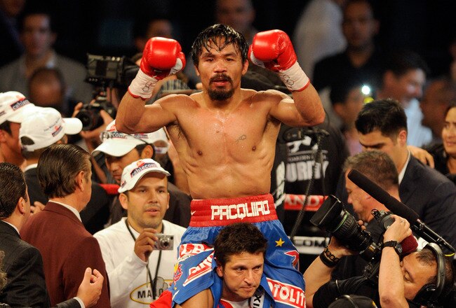 LAS VEGAS, NV - NOVEMBER 12:  Manny Pacquiao celebrates his majority decision victory against Juan Manuel Marquez in the WBO world welterweight title fight at the MGM Grand Garden Arena on November 12, 2011 in Las Vegas, Nevada.  (Photo by Ethan Miller/Getty Images)