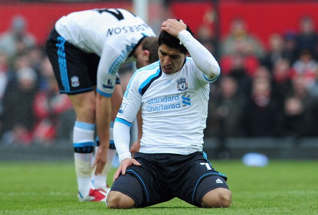 MANCHESTER, ENGLAND - FEBRUARY 11:  Luis Suarez of Liverpool looks dejected during the Barclays Premier League match between Manchester United and Liverpool at Old Trafford on February 11, 2012 in Manchester, England.  (Photo by Shaun Botterill/Getty Images)