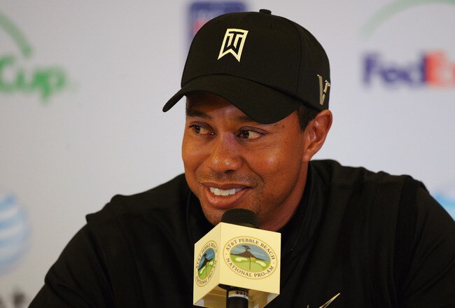 PEBBLE BEACH, CA - FEBRUARY 11:  Tiger Woods is interviewed by the media at a press conference after finishing his third round of the AT&T Pebble Beach National Pro-Am at Pebble Beach Golf Links on February 11, 2012 in Pebble Beach, California.  (Photo by Harry How/Getty Images)
