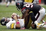 HOUSTON - OCTOBER 02:  Quarterback Ben Roethlisberger #17 of the Pittsburgh Steelers winces in pain after being sacked by outside linebacker Mario Williams #90 of the Houston Texans> at Reliant Stadium on October 2, 2011 in Houston, Texas.  (Photo by Bob Levey/Getty Images)
