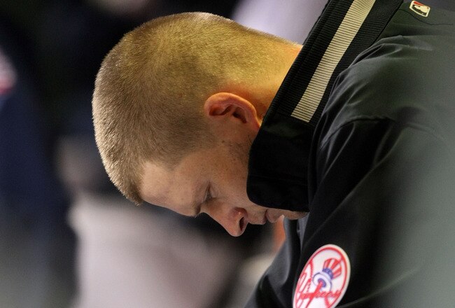PHILADELPHIA - NOVEMBER 02:  A.J. Burnett #34 of the New York Yankees hangs his head dejected in the dugout after he was taken out of the game in the bottom of the third inning against the Philadelphia Phillies in Game Five of the 2009 MLB World Series at Citizens Bank Park on November 2, 2009 in Philadelphia, Pennsylvania.  (Photo by Nick Laham/Getty Images)