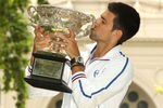 MELBOURNE, AUSTRALIA - JANUARY 30:  Novak Djokovic of Serbia poses with the Norman Brookes Challenge Cup after winning the 2012 men's Australian Open, at Carlton Gardens on January 30, 2012 in Melbourne, Australia.  (Photo by Lucas Dawson/Getty Images)