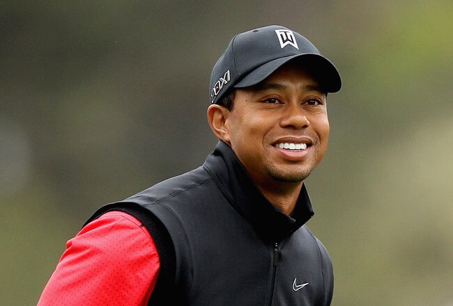 PEBBLE BEACH, CA - FEBRUARY 12: Tiger Woods smiles on the first hole during the final round of the AT&T Pebble Beach National Pro-Am at Pebble Beach Golf Links on February 12, 2012 in Pebble Beach, California.  (Photo by Ezra Shaw/Getty Images)