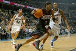 WASHINGTON - NOVEMBER 11:  Allen Iverson #3 of the Philadephia 76ers drives past Gilbert Arenas #0 of  the Washington Wizards during NBA action at the MCI Center on November 11, 2003 in Washington, DC.  NOTE TO USER: User expressly acknowledges and agrees that by downloading and/ or using this photograph, user is consenting to the terms and conditions of the gettyImages licence agreement.  (Photo by Doug Pensinger/Getty Images)
