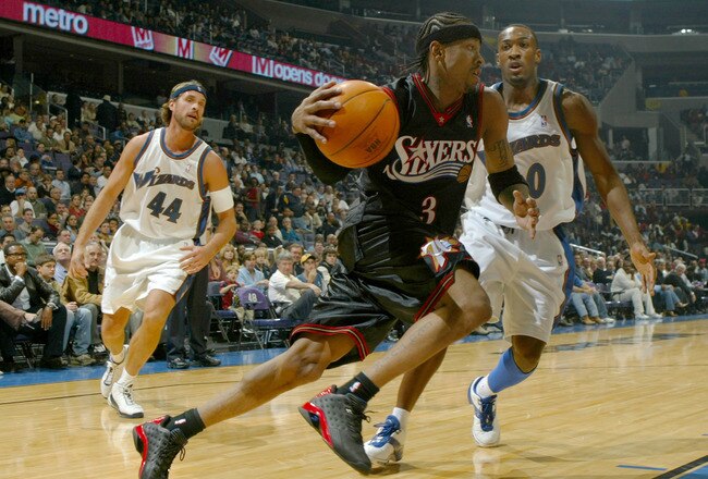 WASHINGTON - NOVEMBER 11:  Allen Iverson #3 of the Philadephia 76ers drives past Gilbert Arenas #0 of  the Washington Wizards during NBA action at the MCI Center on November 11, 2003 in Washington, DC.  NOTE TO USER: User expressly acknowledges and agrees that by downloading and/ or using this photograph, user is consenting to the terms and conditions of the gettyImages licence agreement.  (Photo by Doug Pensinger/Getty Images)